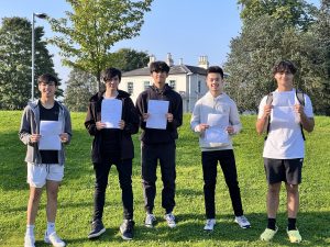 A group of students from Cardinal Heenan pose with their results