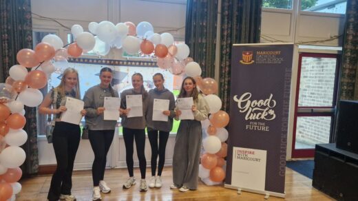 A group of Maricourt students stand proudly with their GCSE results