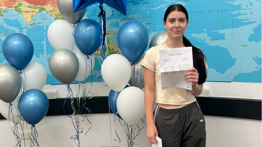 Amelia Jones from St John Plessington holding up results on GCSE results day