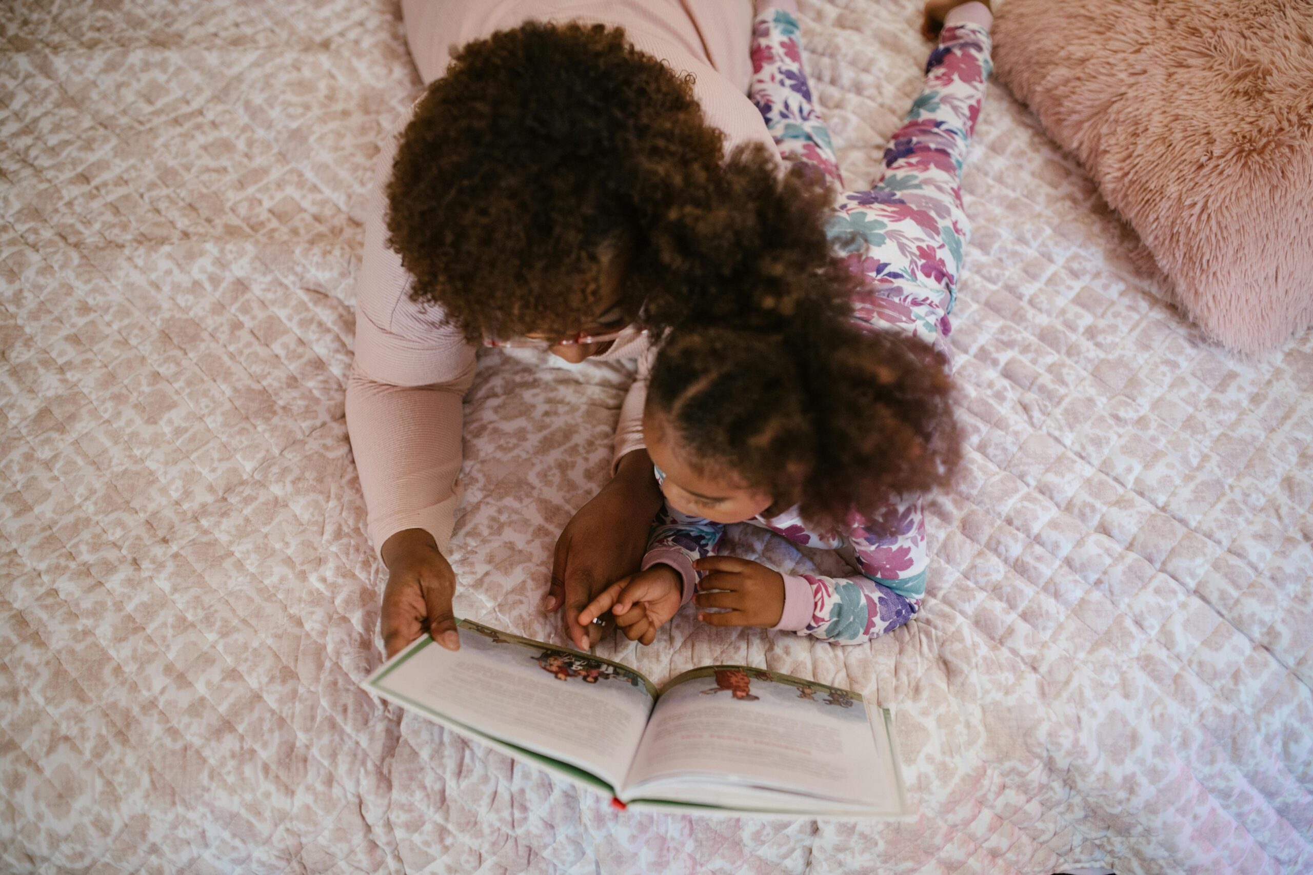 Child and parent reading together